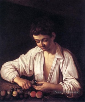 Garçon épluchant un fruit Caravaggio Peinture à l'huile